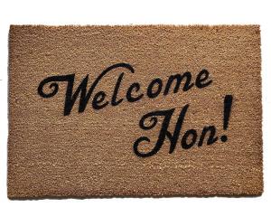 Sustainable coir doormat with "Welcome Hon" Baltimore Maryland text on a front porch