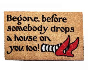 Begone, before somebody drops a house on you, too! Wizard Oz mat ruby slippers