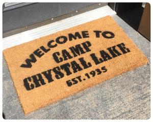 Sustainable coir doormat printed with Camp Crystal Lake Friday the 13th camp welcome design, horror movie doormat