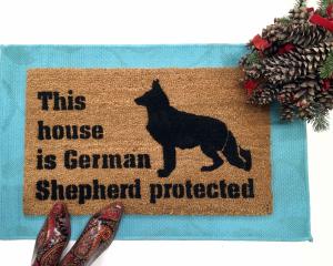This house is German Shepard protected dog door mat