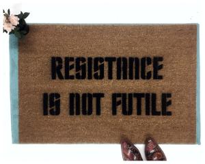 Brown coir doormat with 'Resistance Is NOT Futile' sci-fi welcome mat design