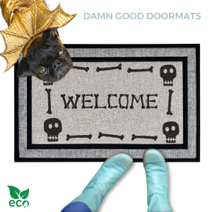 a black pug dog in a Halloween gold dragon costume welcome mat with the word "WELCOME", and a pair of feet wearing Smurf blue boots