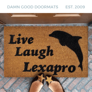 Live Laugh LEXAPRO dolphin doormat on a brick patio