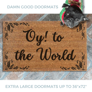 Coir doormat printed with Oy to the world, wipe your feet in bold blue letters