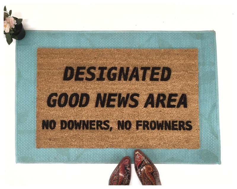 Designated Good News Area- no downers, no frowners! This funny doormat