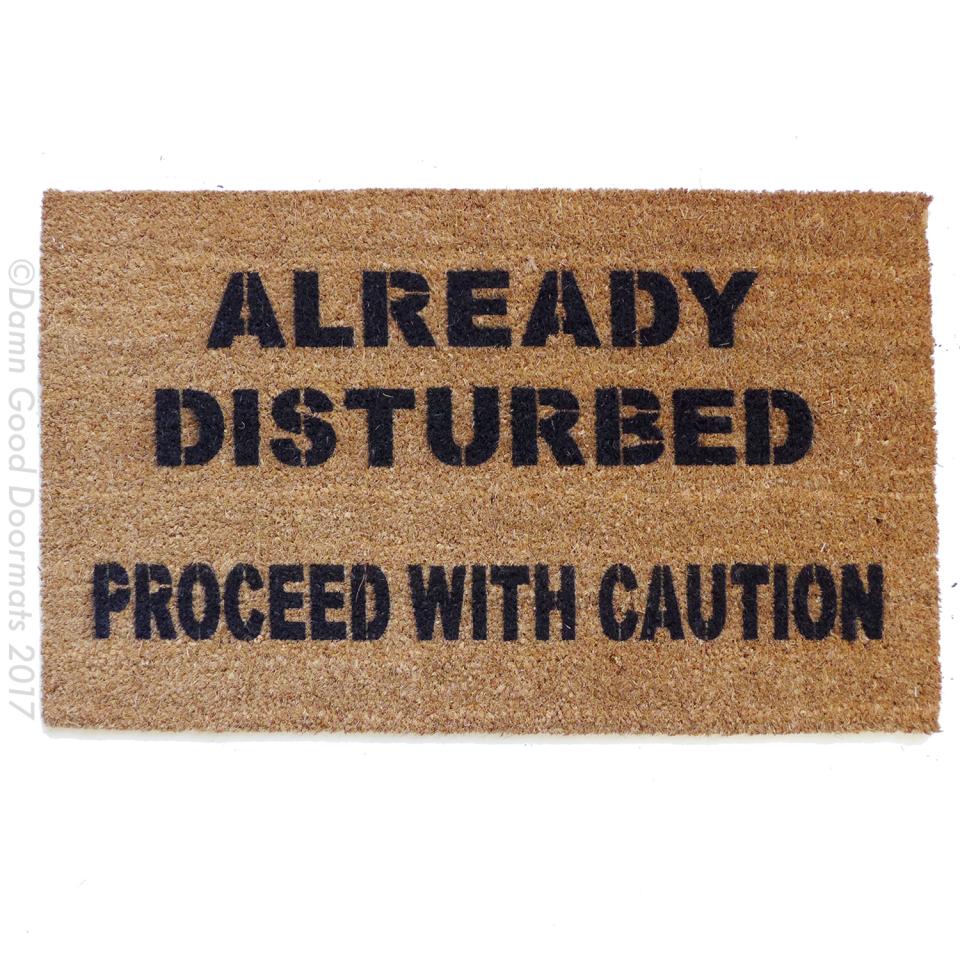 Coir Halloween doormat with 'Already disturbed, proceed with caution' text, funny welcome mat for front door