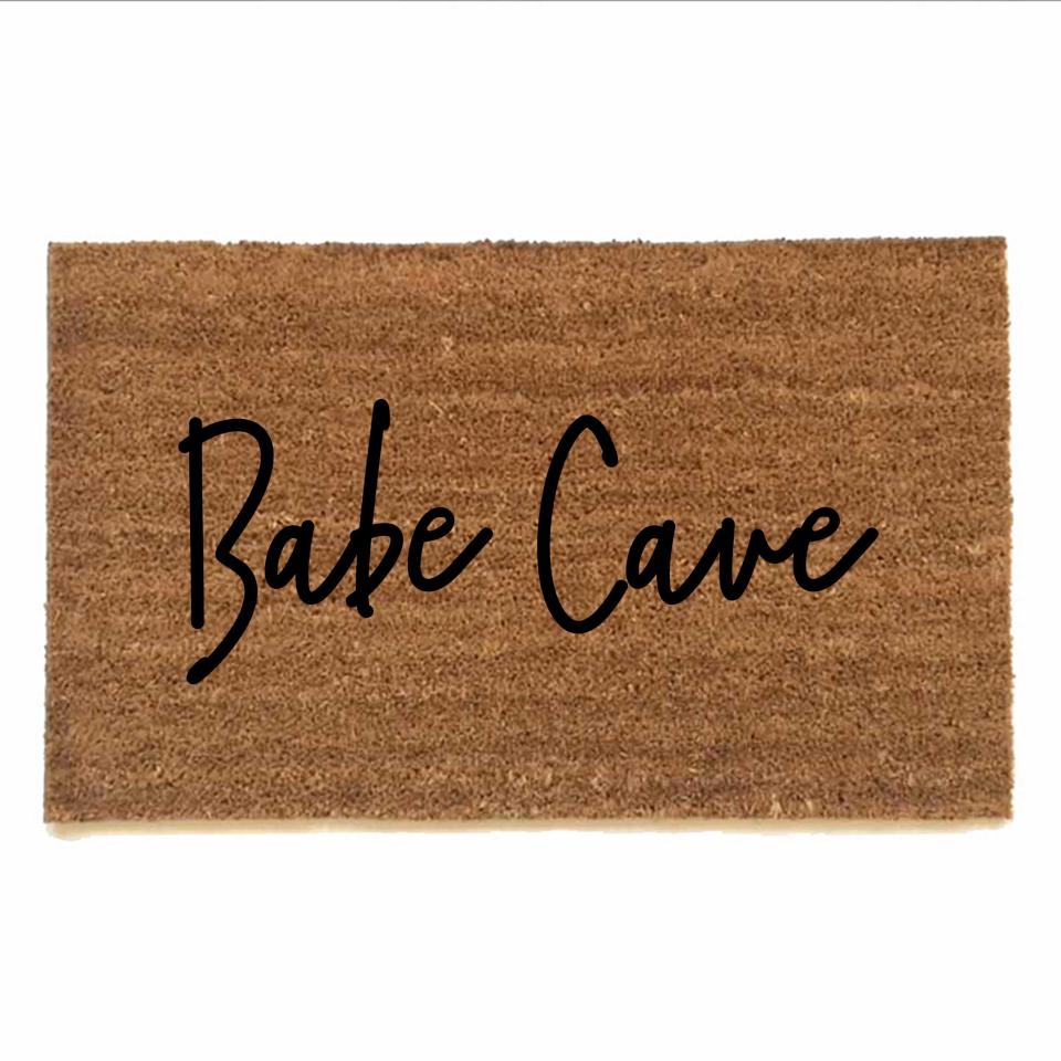 outdoor coir doormat reading "Babe Cave"