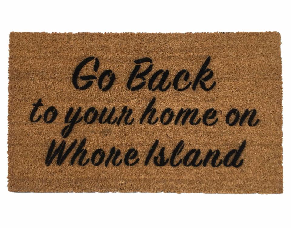 Coir doormat printed with 'GO BACK to your Home on Whore Island' funny Anchorman-inspired welcome mat