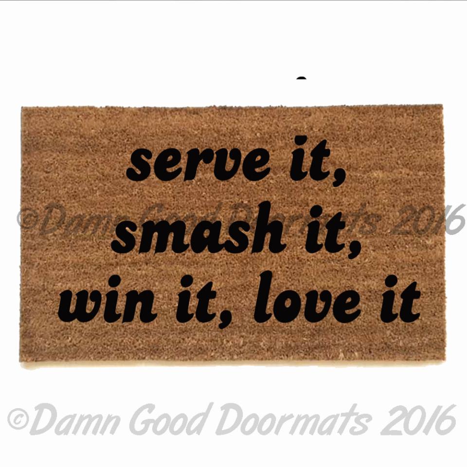Tennis-themed doormat with "Smash It, Serve It, Love It" text on sustainable coir material