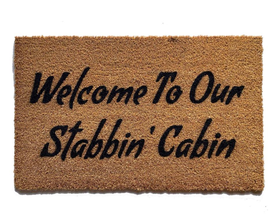 Coir doormat printed with 'Welcome To Our Stabbin Cabin' 