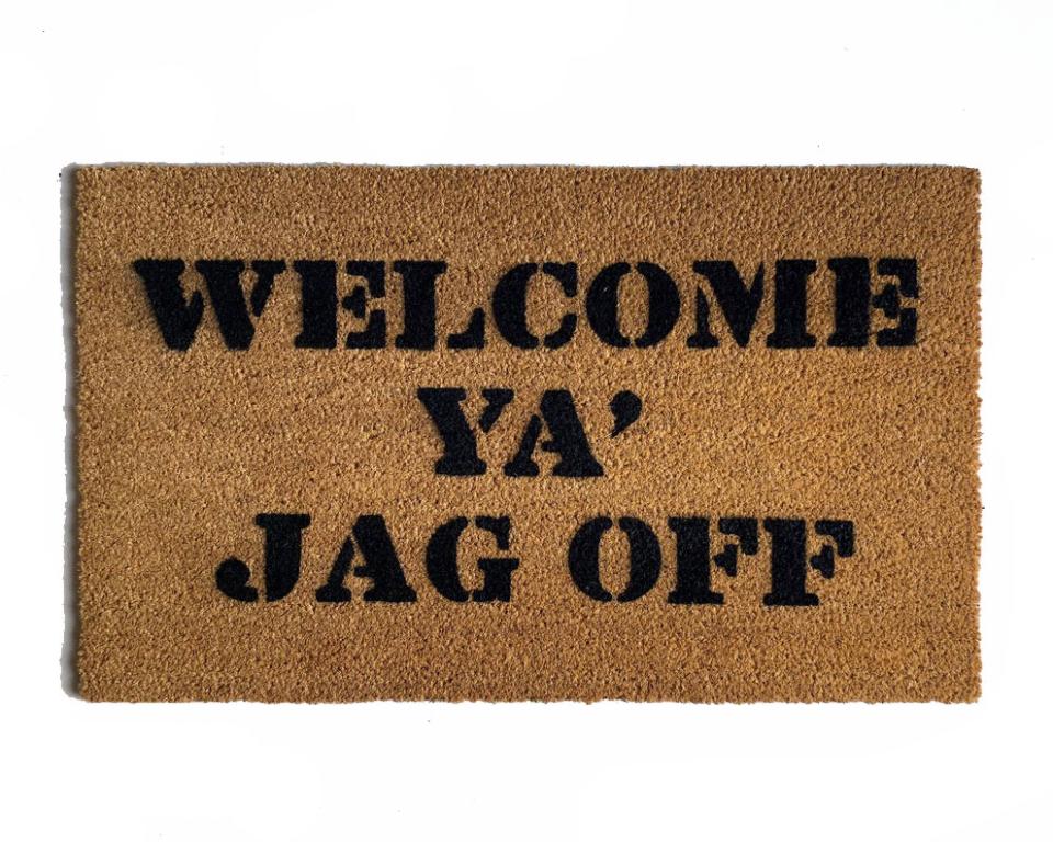 Coir doormat with WELCOME YA JAG OFF text, a funny Pittsburgh welcome mat for the front door.