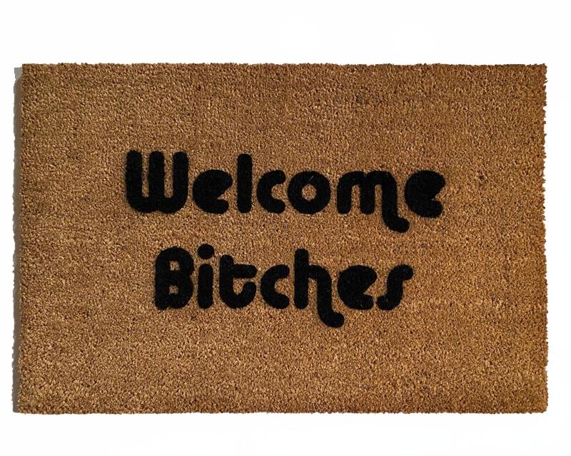 outdoor coir doormat with text "welcome bitches" on it