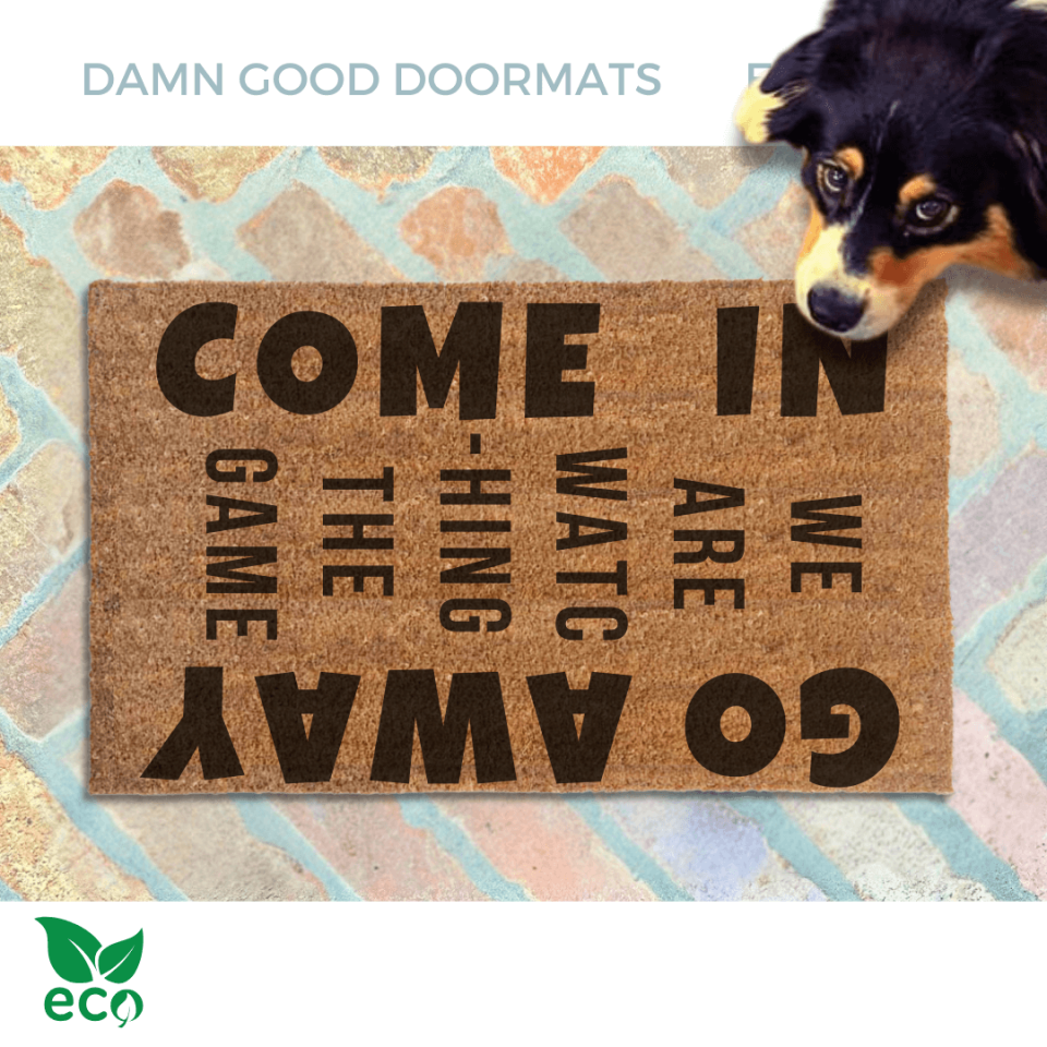 Come In / Go Away, We're watching the game door mat pictured with a shepard dog looking up