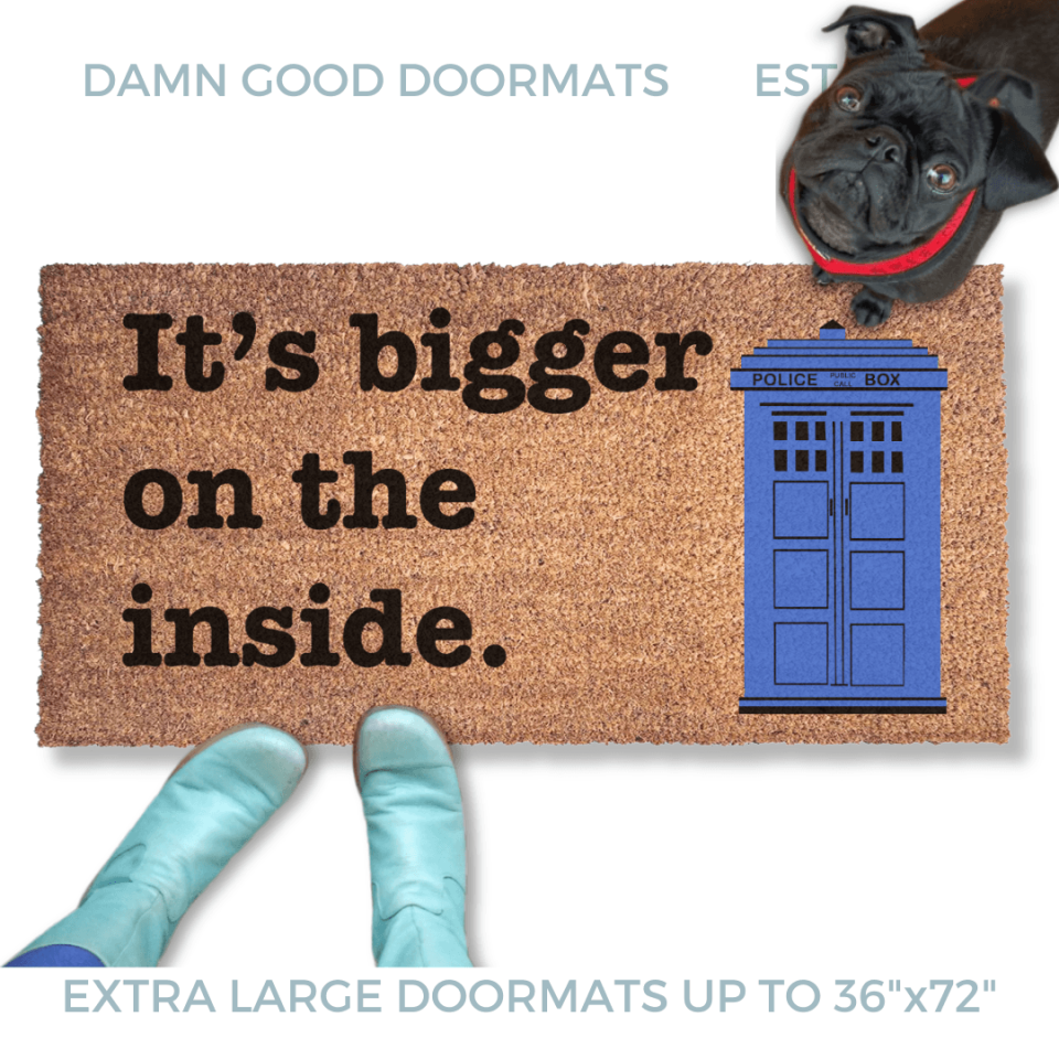 Blue TARDIS police box doormat reading Bigger On The Inside on a front porch