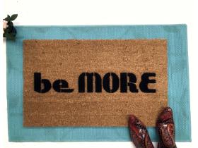 Sustainable coir doormat printed with 'be MORE Baltimore,' a Bmore pride welcome mat