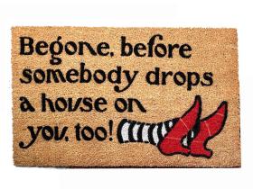 Begone, before somebody drops a house on you, too! Wizard Oz mat ruby slippers