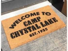 Sustainable coir doormat printed with Camp Crystal Lake Friday the 13th camp welcome design, horror movie doormat