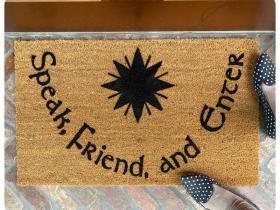 Coir doormat printed with Speak, Friend, and Enter and the Star of Fëanor, a Tolkien entrance mat.
