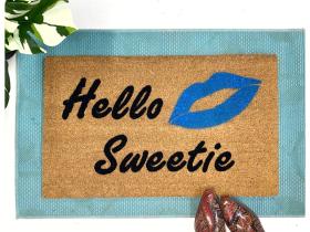 doormat with River Song's 'Hello Sweetie' Doctor Who quote and lipstick kiss mark design