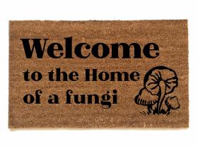 photo of outdoor coir doormat reading welcome to the home of a fungii mushrooms