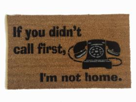 Brown coir doormat with an old rotary style phone and black text reading Didn't Call First? Go Away, funny front door welcome mat
