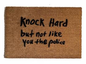 Sustainable coir doormat that reads Knock Hard, But Not Like You The Police, a funny sarcastic front door mat