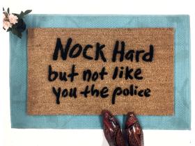 Sustainable coir doormat with 'Knock Hard, Not Like The Police' printed welcome mat design