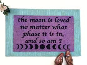 purple coir doormat with moon phase image and saying The moon is loved