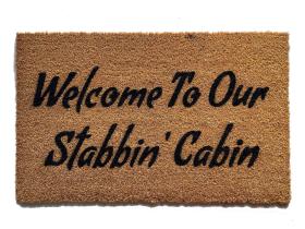 Coir doormat printed with 'Welcome To Our Stabbin Cabin' 