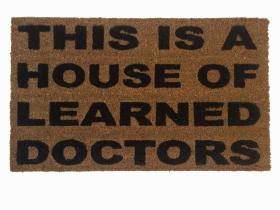 Natural coir doormat printed with House of Learned Doctors, a Step Brothers quote welcome mat for PhD grads