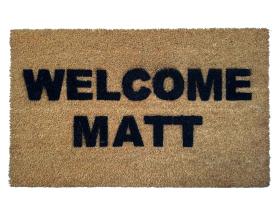 Natural coir doormat with Welcome Matt in bold black letters — funny punny welcome mat