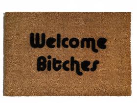outdoor coir doormat with text "welcome bitches" on it