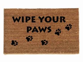 sustainable coir doormat with dog paw prints reading "wipe your paws"