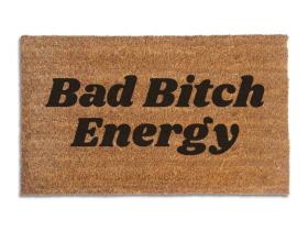 Coir doormat printed with Bad Bitch Energy in bold black italic slab lettering