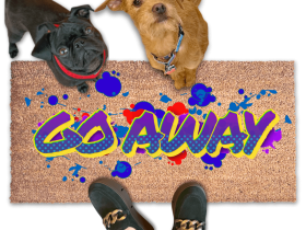 a pug and terrier dogs and a person in green creepers standing on a door mat with the word "GO AWAY" written on it in a spray paint graffitti style.