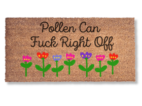 promotional image of a coir doormat reading "pollen can fuck right off" in cursive with red and purple tulips across the bottom