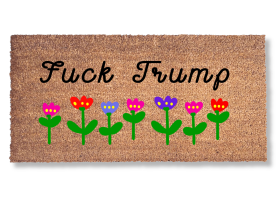 promotional image of a coir doormat reading "fuck Trump" in cursive with red and purple flowers across the top and bottom