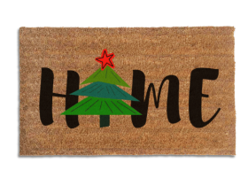 Coir doormat printed with HOME in black brush lettering, with a green Christmas tree topped by a red star standing in for the O
